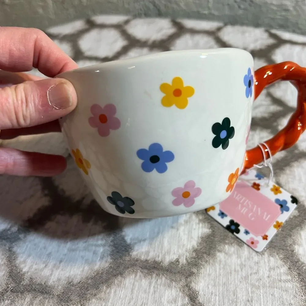 Artisan Mug with Floral Design and Orange Handle